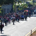 Migrant caravan in southern Mexico marks Christmas Day by trudging onward