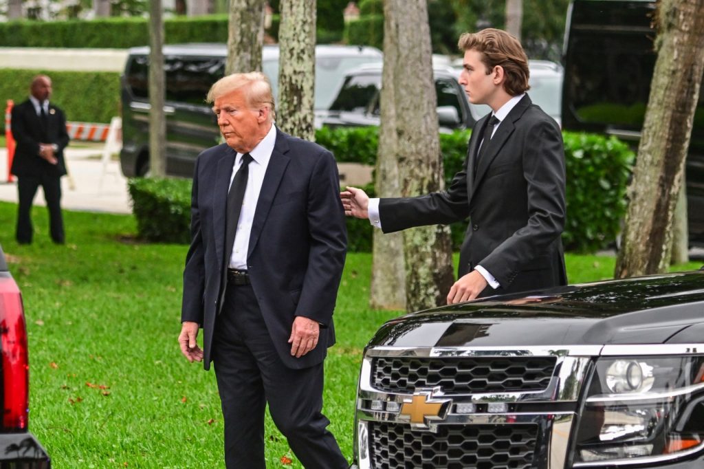 Barron Trump reaches out to sad-looking father at funeral for Melania’s mother