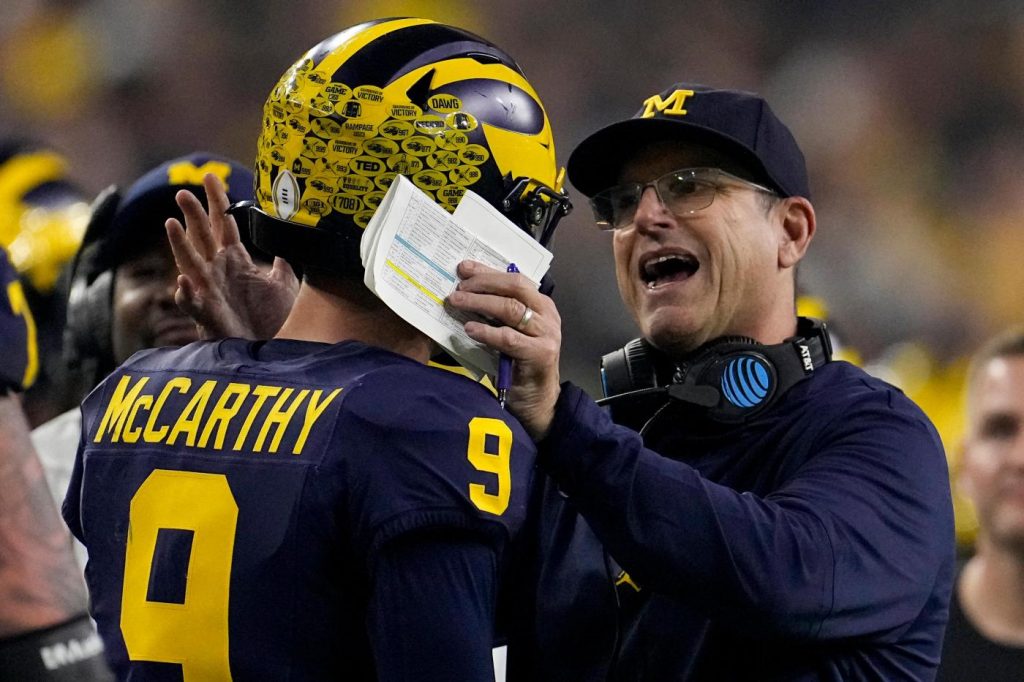 Harbaugh delivers a national title as Michigan overpowers Washington 34-13