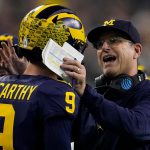 Harbaugh delivers a national title as Michigan overpowers Washington 34-13