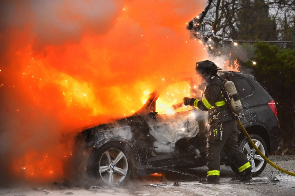 Firefighters tackle a BMW on fire on I-680 in Walnut Creek