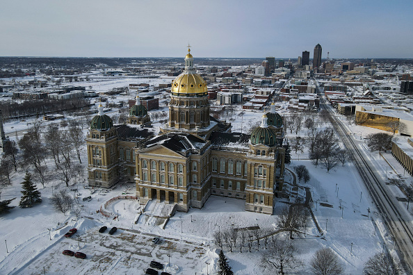 AP VoteCast: Iowa caucusgoers want big changes, see immigration as more important than the economy