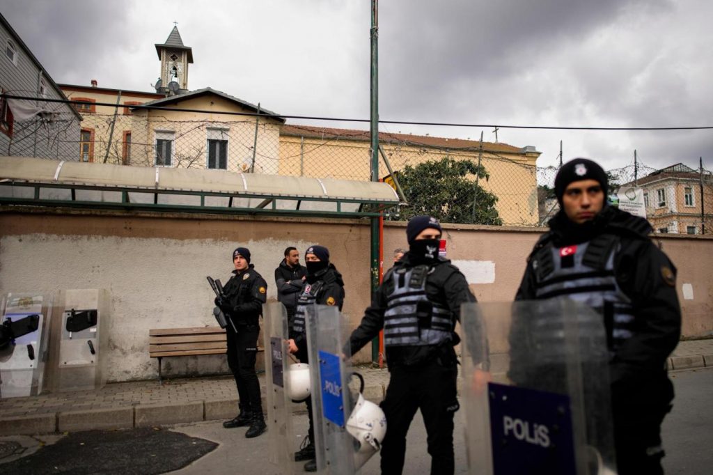 2 masked men kill a person in attack on Catholic church in Istanbul. Officials detain 2 ISIS members