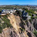 Massive landslide on coastal bluff leaves California mansion on the edge of a cliff