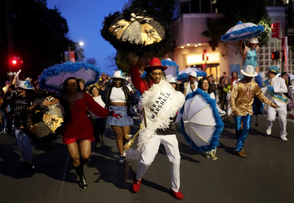 Photos: M.J.’s Brass Boppers lead the way during their annual Mardi Gras parade in Oakland