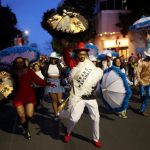 Photos: M.J.’s Brass Boppers lead the way during their annual Mardi Gras parade in Oakland