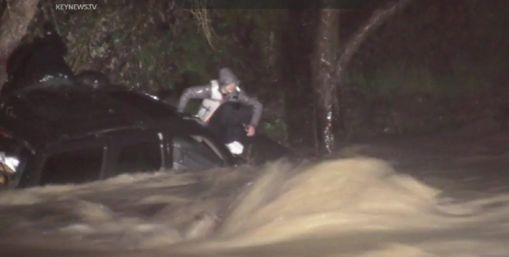 3 people saved from tree after SUV is washed down Southern California creek