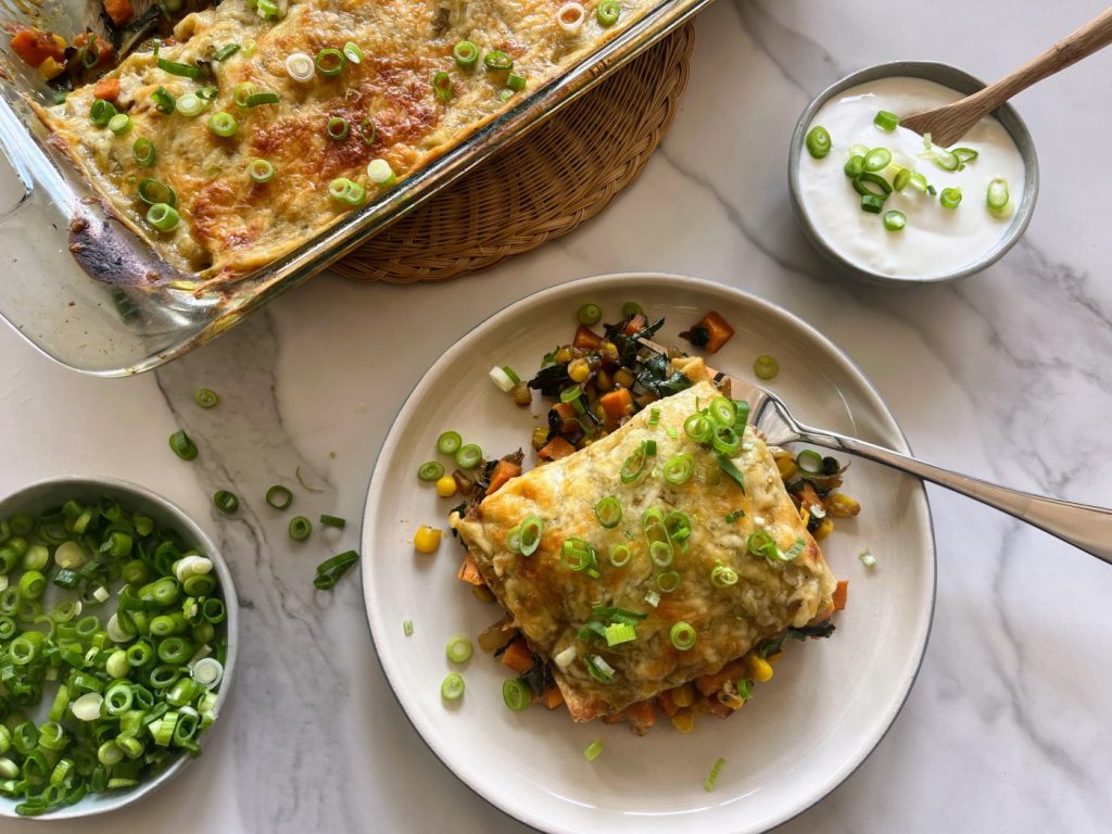 Feed a crowd with this easy Chard and Sweet Potato Green Enchilada Bake