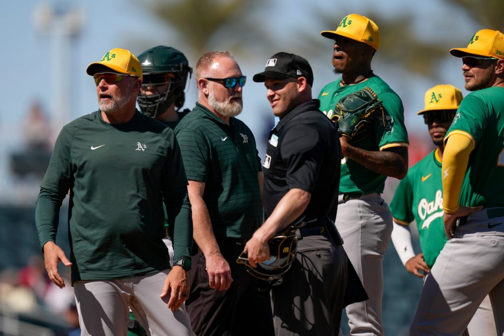 A’s starting pitcher suffers knee injury in spring training loss to Reds