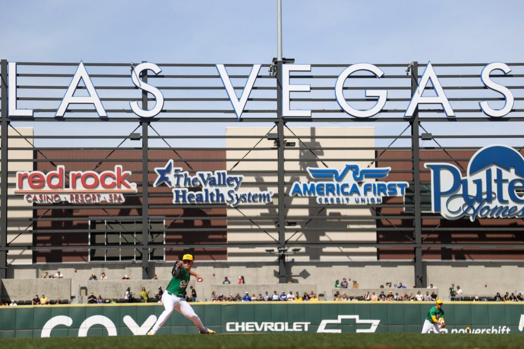 Some fans in Las Vegas wear ‘S-E-L-L’ shirts while watching A’s play spring training game