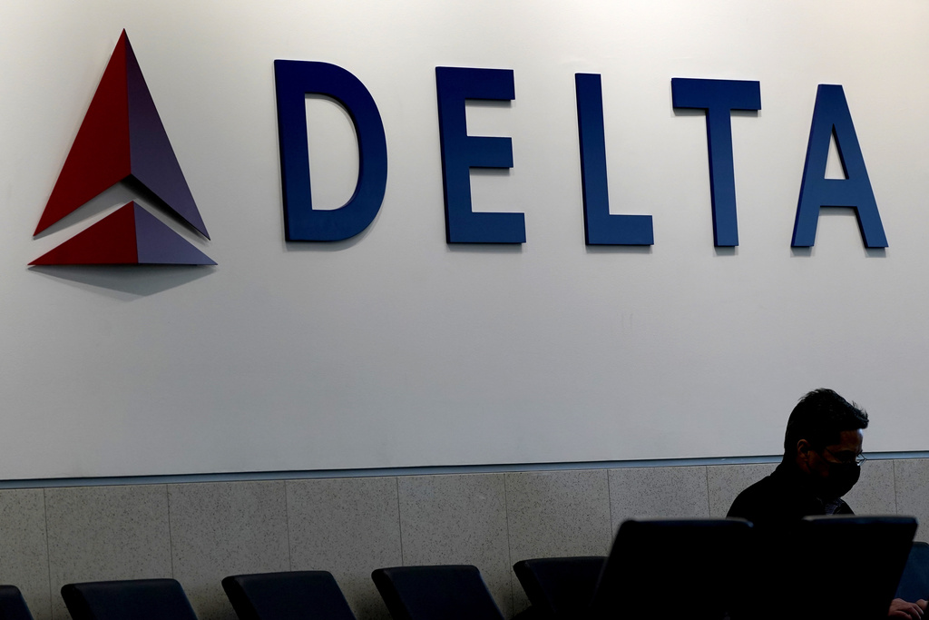 An emergency slide falls off a California-bound Delta plane, forcing pilots to return to New York