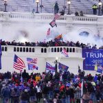 Man who attacked police after storming Capitol with Confederate flag gets over 2 years in prison