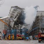 Firefighters work carefully around remains of Copenhagen landmark