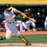 Athletics muscle up to beat Rangers in first game of doubleheader