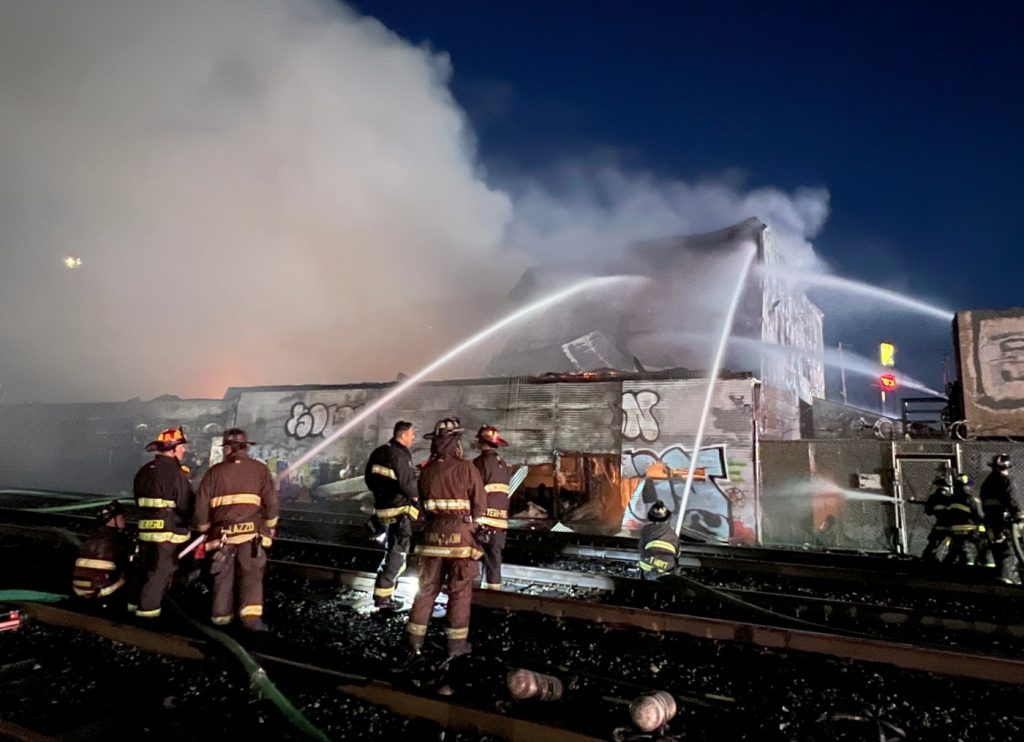 Four-alarm fire burns lumber yard in Oakland