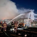 Four-alarm fire burns lumber yard in Oakland