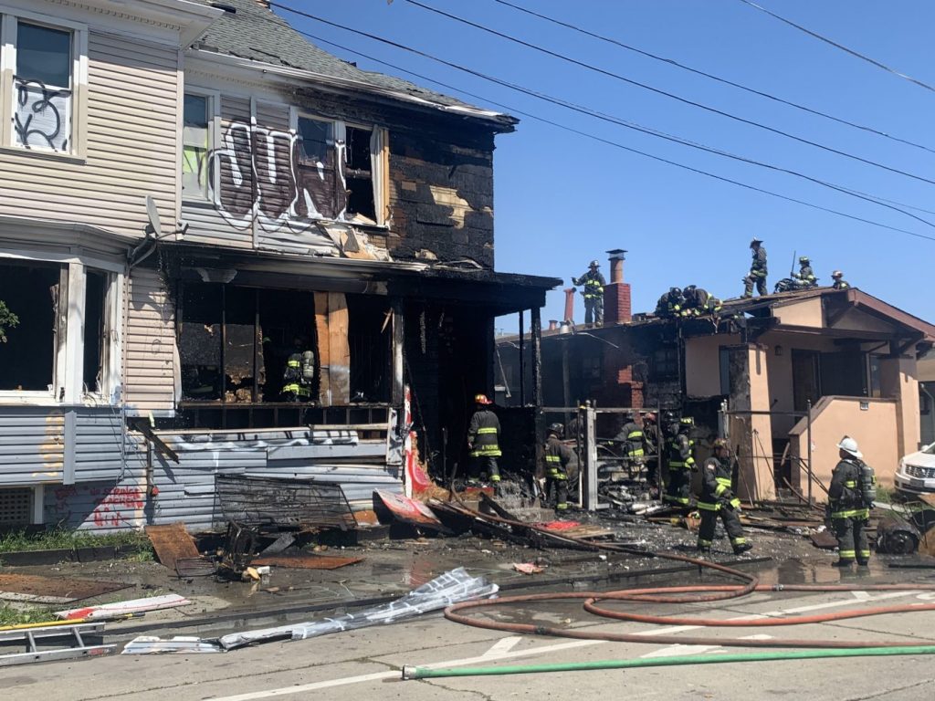 3-alarm Oakland fire nearly destroys one vacant residence, badly damages a second occupied home