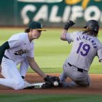 A’s come back to force extras but fall to Rockies