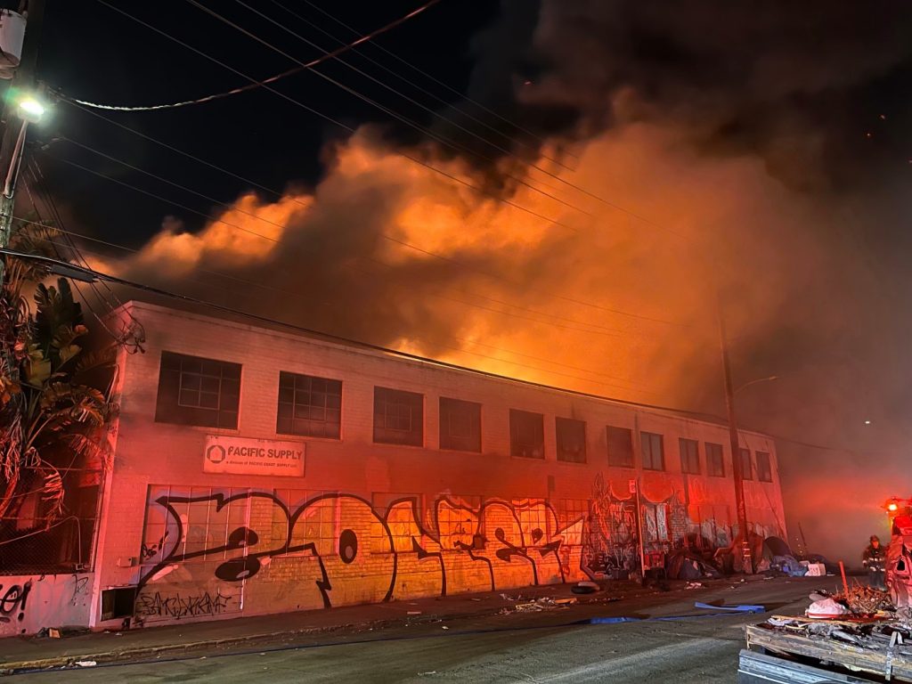 Three-alarm fire torches West Oakland roofing supply business