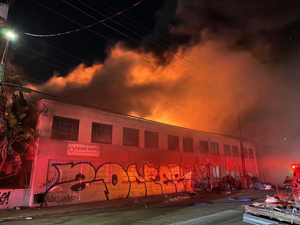 Three-alarm fire rips through West Oakland warehouse