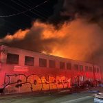 Three-alarm fire rips through West Oakland warehouse