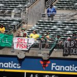 “SELL” flag behind home plate makes brief late-game TV appearance before A’s fan removed