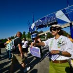 Disneyland union hands out Mickey Mouse raised fist buttons to theme park visitors