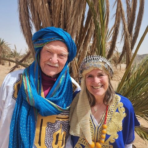 Wish You Were Here: Atop camels in the Sahara Desert