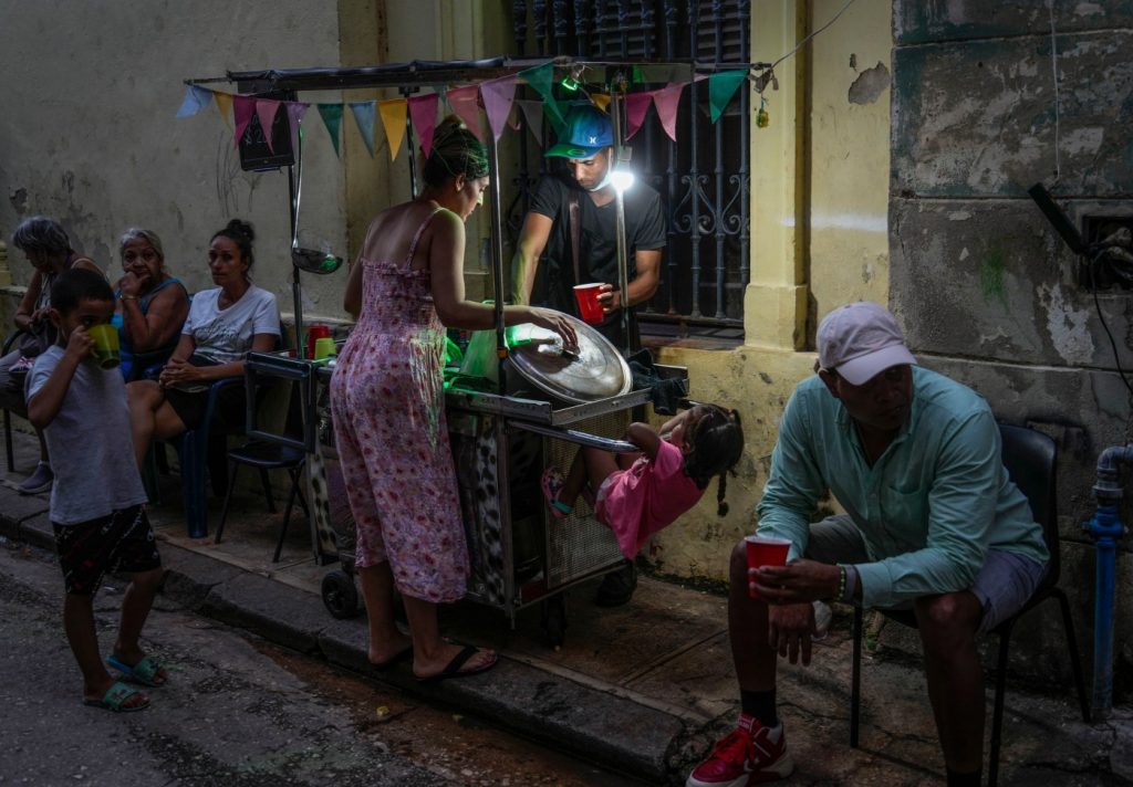 Cuba fights to come back from a nationwide blackout, then a storm that killed 7