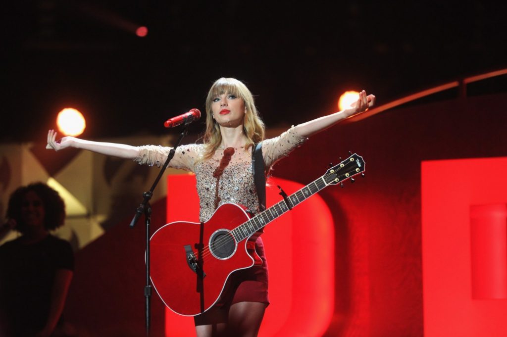 Man buys Taylor Swift-autographed guitar at charity auction, smashes it with hammer