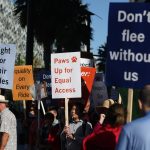 People with blindness and their allies rally outside Uber and Lyft over ride denials