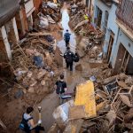 Families hold out hope for flood survivors in Spain